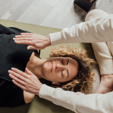 Holistic energy healing session in a peaceful wellbeing studio promoting deep relaxation and balance.